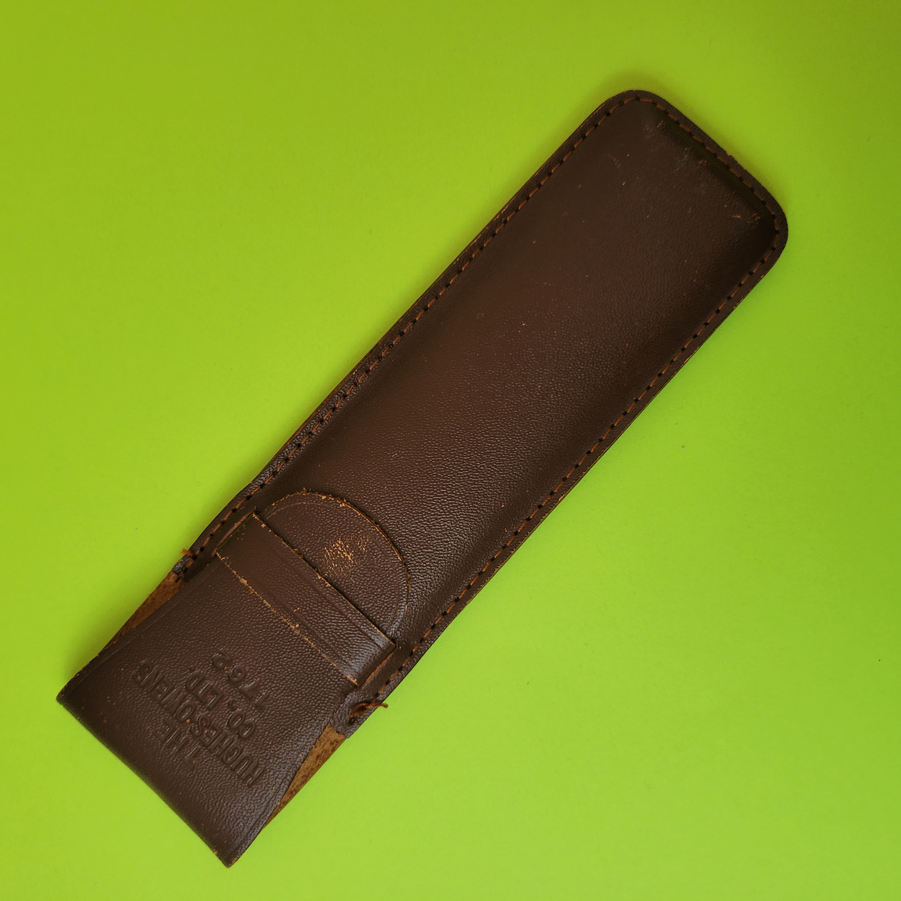 An image of the front of the case of a Hughes-Owens Co (Sun Hemmi) No.1762 slide rule